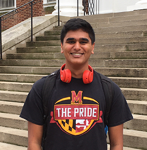 headshot of Vishal outside building wearing Maryland t-shirt